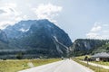 Austria - July, 2019: Asphalt road in Austria, Alps in a beautiful summer day Royalty Free Stock Photo