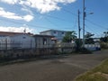 Asphalt road and cement wall and houses in Puerto Rico