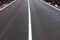 Asphalt road center white line on freeway or highway