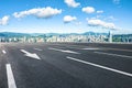 Asphalt road with city buildings skyline background Royalty Free Stock Photo