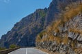 Asphalt road. Colorful landscape with beautiful mountain road with a perfect asphalt. High rocks, blue sky at sunrise in Royalty Free Stock Photo