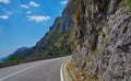 Asphalt road. Colorful landscape with beautiful mountain road with a perfect asphalt. High rocks, blue sky at sunrise in Royalty Free Stock Photo