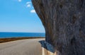 Asphalt road. Colorful landscape with beautiful mountain road with a perfect asphalt. High rocks, blue sky at sunrise in Royalty Free Stock Photo