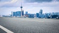 Asphalt road and commercial buildings skyline