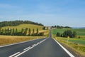 Asphalt road cutting through the rural landscape Royalty Free Stock Photo