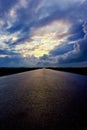 Asphalt road and dark thunder clouds over it Royalty Free Stock Photo