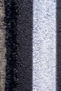 Asphalt road edge, closeup detail of black tarmac road delimitation, top view background