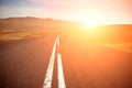 Asphalt Road field landscape with the bright solar effect Royalty Free Stock Photo