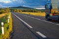 Asphalt road through the fields towards the horizon