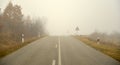 An asphalt road with fog in winter