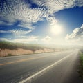 Asphalt road in forrest and bule sky for transportation Royalty Free Stock Photo