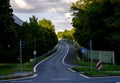 Asphalt road in Germany with trees on the roadside and traffic signs Royalty Free Stock Photo