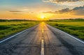 Asphalt road through the green field and clouds at sunset Royalty Free Stock Photo