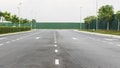 Asphalt road and green hording Royalty Free Stock Photo