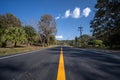 Asphalt road and green tree under blue sky. Road and mountain background. empty asphalt road , Country Road, Transportation Royalty Free Stock Photo
