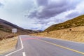 Asphalt road High way Empty curved road clouds, sky and mountain