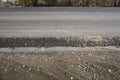 Asphalt road, highway, driveway construction and renovation. A close-up of an asphalt pavement structure with a broad surface Royalty Free Stock Photo