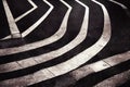 Asphalt road highway traffic surface with white safety striped marking dividing lines abstract grunge background