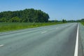Asphalt road on a hot sunny day with mixed forest on the sides. Happy family car tourism concept Royalty Free Stock Photo