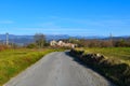 Asphalt road in Istria, Slovenia with Pomjan village Royalty Free Stock Photo