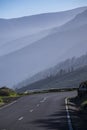 Asphalt road. Landscape with rocks, sunny sky with clouds and beautiful mountain road with a perfect asphalt at sunrise in summer Royalty Free Stock Photo