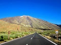 Asphalt road leading to el Teide volcano in the National Park of Tenerife Canary Islands Spain Royalty Free Stock Photo