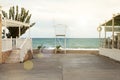 An asphalt road leads to the beach. Rack of lifeguards. Royalty Free Stock Photo