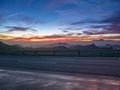 Asphalt road in the mountains at sunset