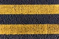 Asphalt road and painted yellow lines