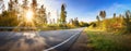 Asphalt road panorama in countryside on sunset in summer. Royalty Free Stock Photo