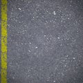 Asphalt road pavement with cracked yellow marking