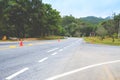 Asphalt road sharp curve along with tropical forest,