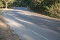 Asphalt road sharp curve along with tropical forest zigzag ahead