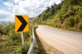 Asphalt road sharp curve along with tropical forest zigzag ahead