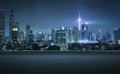 Asphalt road side with beautiful Kuala Lumpur city skyline