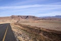 Asphalt Road Stretching Through Arid Dry Winter Landscape Royalty Free Stock Photo