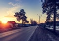 Asphalt road at sunrise and sunlight. Spring background