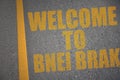asphalt road with text welcome to Bnei Brak near yellow line Royalty Free Stock Photo