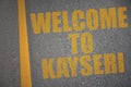 asphalt road with text welcome to Kayseri near yellow line