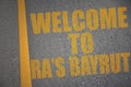 asphalt road with text welcome to Ra\'s Bayrut near yellow line