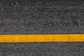 Asphalt road texture background with yellow stripes Royalty Free Stock Photo