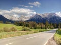 Asphalt road under the Alp mountains Royalty Free Stock Photo