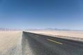 Asphalt road through the wind farm Royalty Free Stock Photo