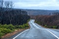 asphalt road winds through the Australian landscape