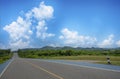 Asphalt roads and bicycle lanes with blue sky and clouds