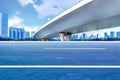 Asphalt roads and city buildings under the overpass, automobile advertising road material.