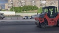 Asphalt roller leveling road pressure. Repair smooth surface industrial highway.