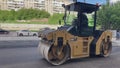 Asphalt roller leveling road pressure. Repair smooth surface industrial highway.