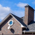 Asphalt shingle. Decorative bitumen shingles on the roof of a brick Royalty Free Stock Photo