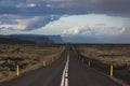 Asphalt straight road in Iceland through the lava field at summer season